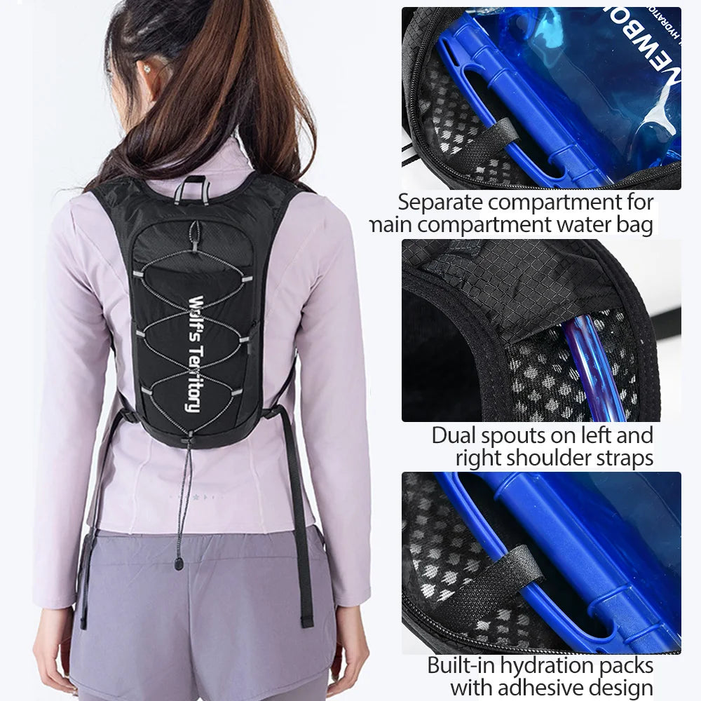 Black hydration vest with blue accents worn by a woman, featuring separate compartments and dual shoulder straps.