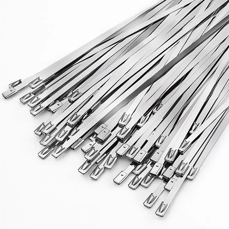 A collection of heavy-duty stainless steel cable ties arranged diagonally.