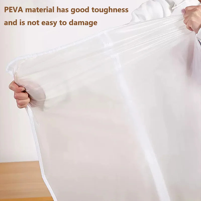 A hand holds a clear plastic garment bag, demonstrating the toughness of PEVA material for clothing storage.