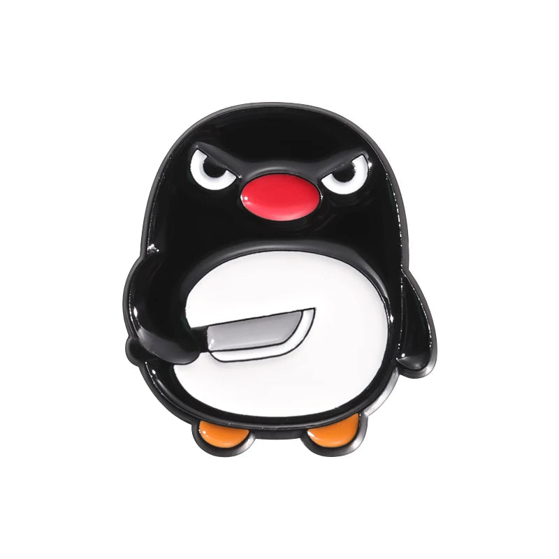 A black cartoon penguin enamel pin with a red beak and white belly.