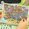 A hand is holding an open sticker book featuring a colorful miniature scene of a bustling city with various vehicles and buil