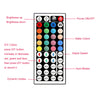 A control panel for an RGB LED strip light featuring buttons for power, color selection, speed adjustment, and auto modes.