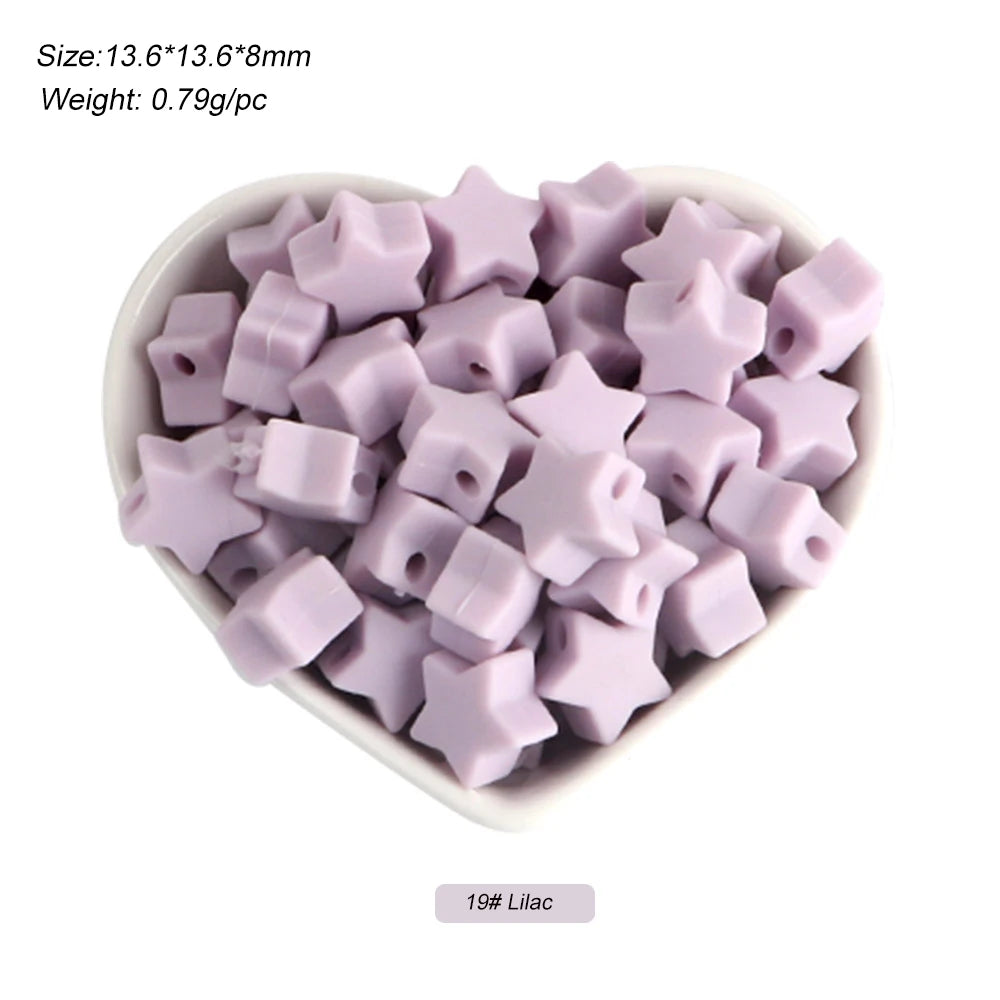 A pile of purple silicone star heart beads for DIY jewelry making