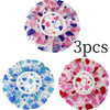 Three reusable polka dot waterproof shower caps in pink, purple, and blue floral patterns.