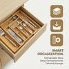 A wooden drawer organizer with multiple slots for cutlery and utensils, showing smart organization features.