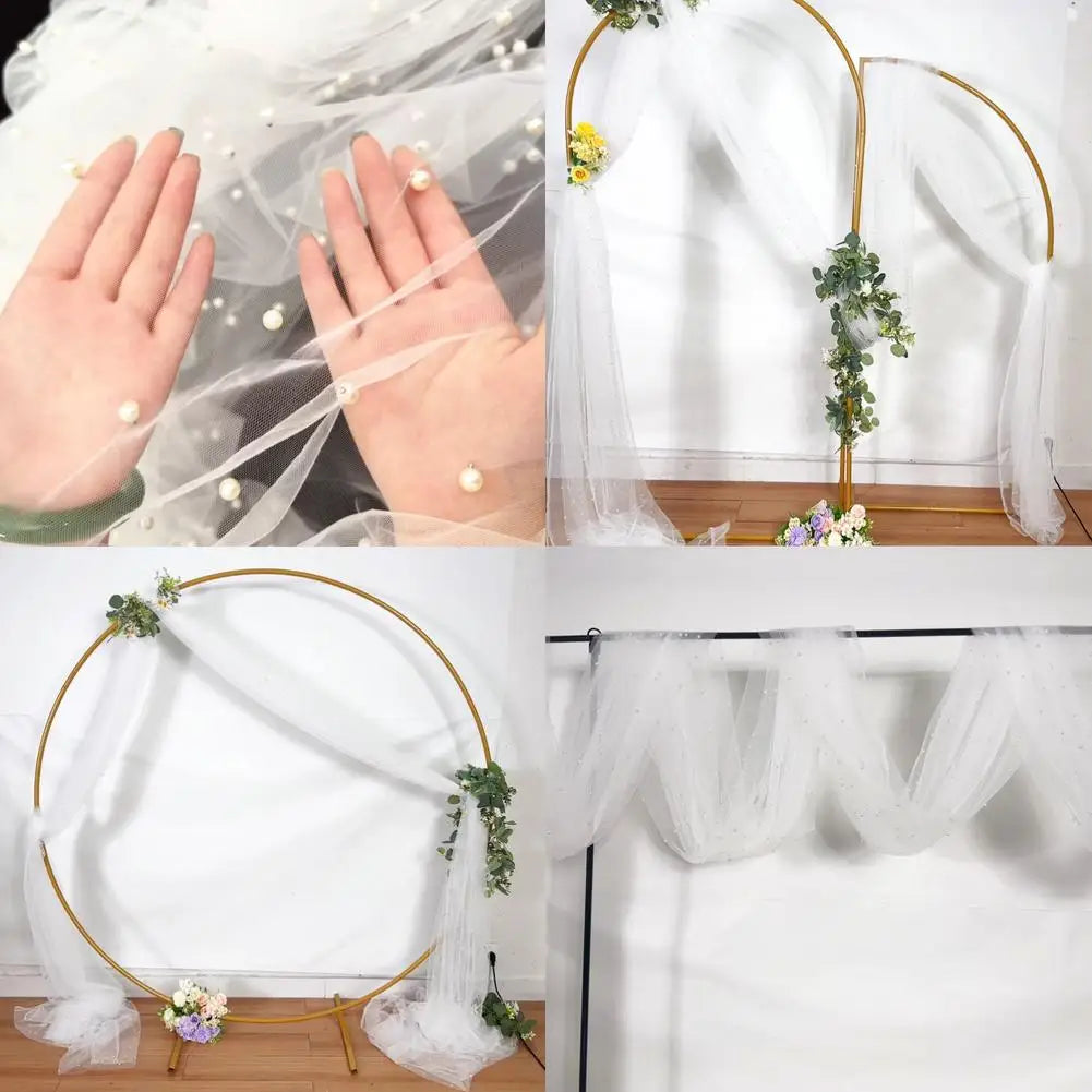 Pearl beaded tulle table runner and sheer gauze tablecloth displayed for weddings and events.