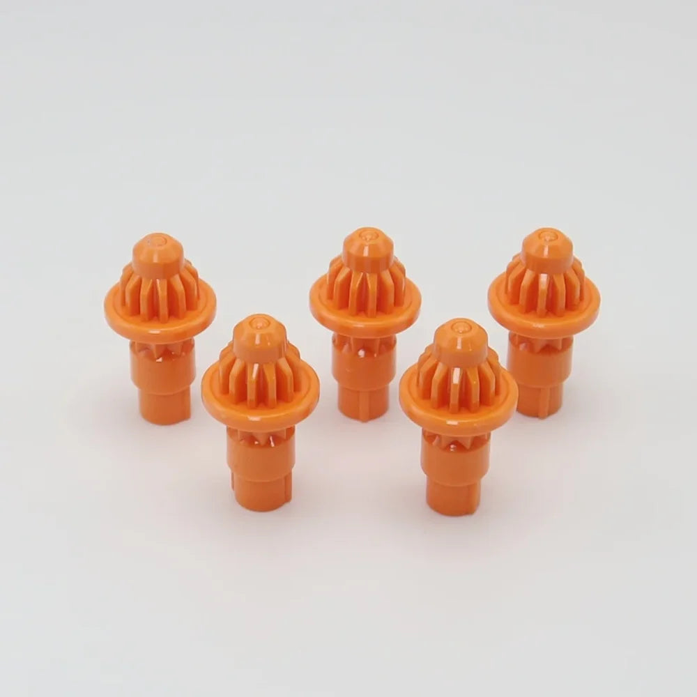 A set of five orange replacement drivers for a Battling Top, used to fix or replace the top mechanism.