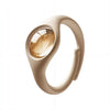 A beige wristband with a clear window showing a golden liquid, designed as a natural mosquito repellent.