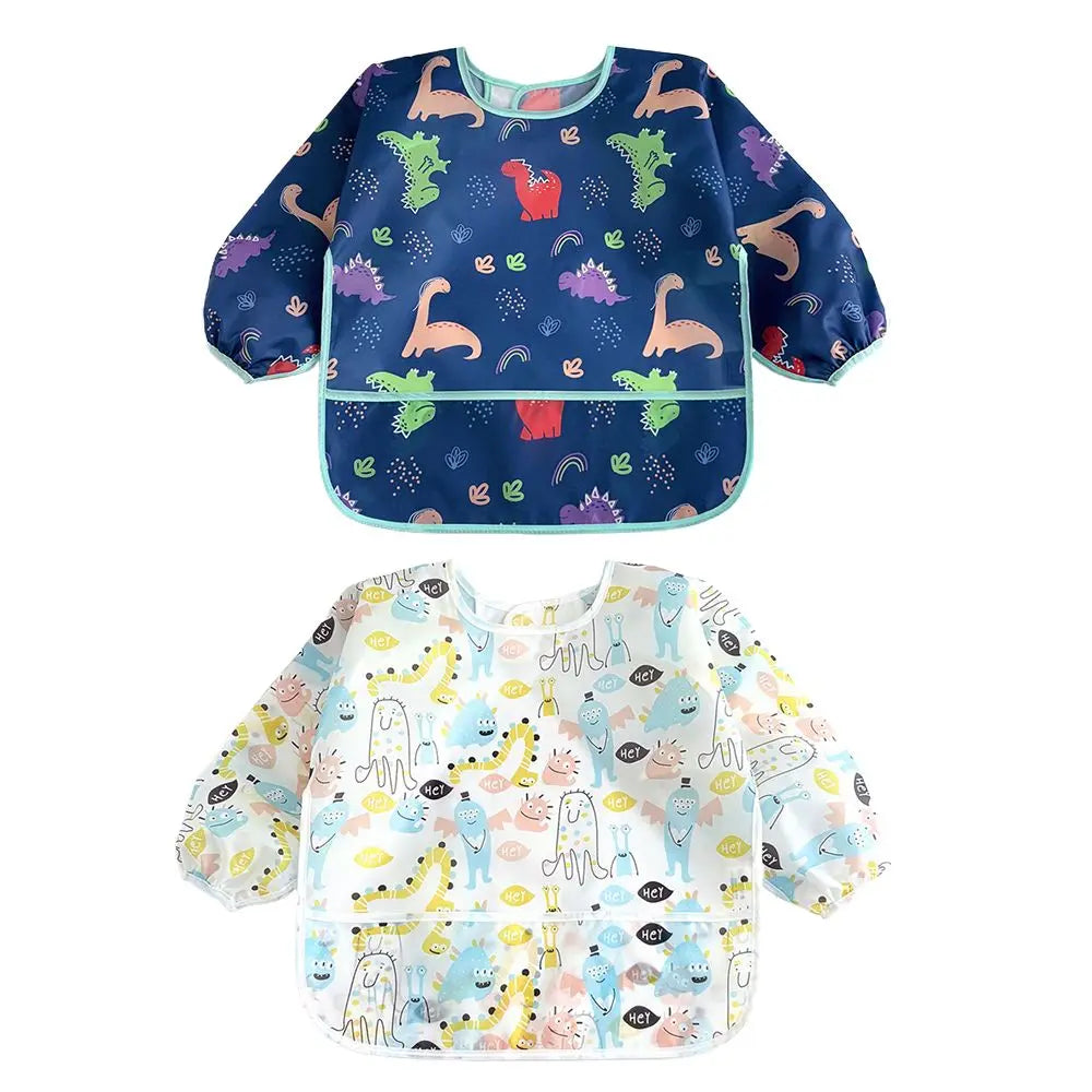 A pair of colorful waterproof long-sleeve baby bibs featuring various animal and nature patterns.