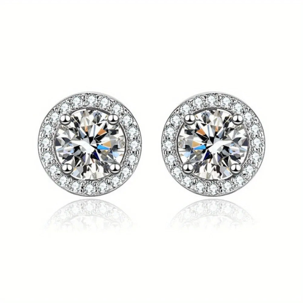 A pair of silver-tone cubic zirconia stud earrings with round brilliant-cut stones.