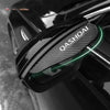 Carbon fiber rearview mirror rain guards installed on a black vehicle.