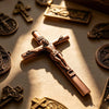 A bronze crucifix pen set featuring an INRI Jesus cross writing instrument with a metal finish.