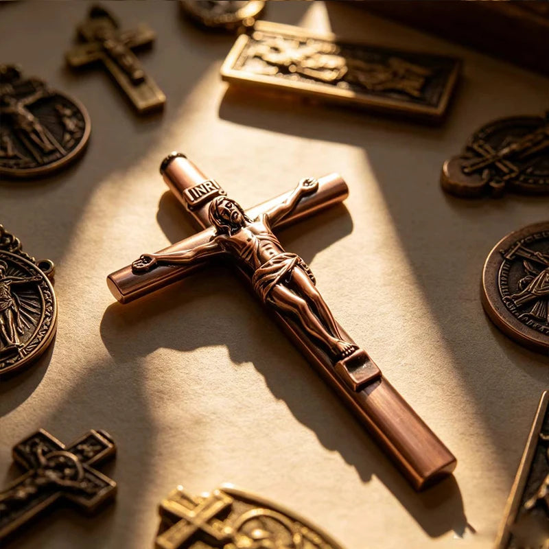 A bronze crucifix pen set featuring an INRI Jesus cross writing instrument with a metal finish.