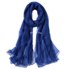 A deep blue silk scarf draped elegantly