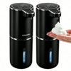 A black touchless automatic soap dispenser with a white soap bar is shown on a hand.
