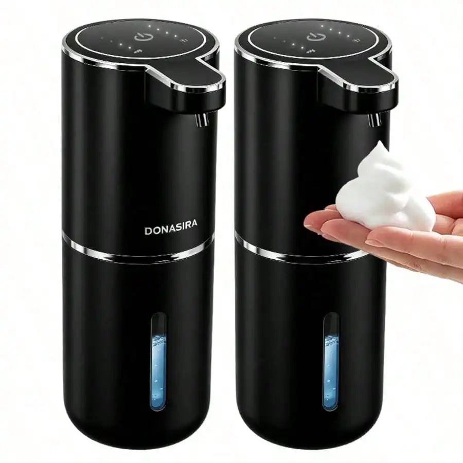 A black touchless automatic soap dispenser with a white soap bar is shown on a hand.