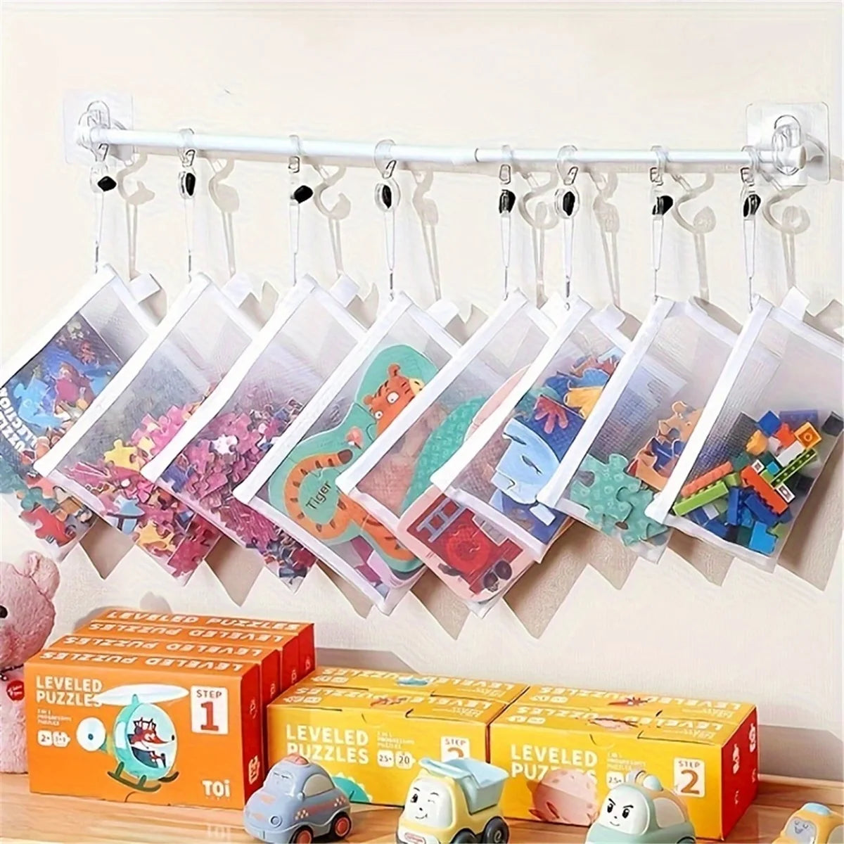 A set of eight transparent mesh zipper pouches in three sizes displayed on a clothesline.