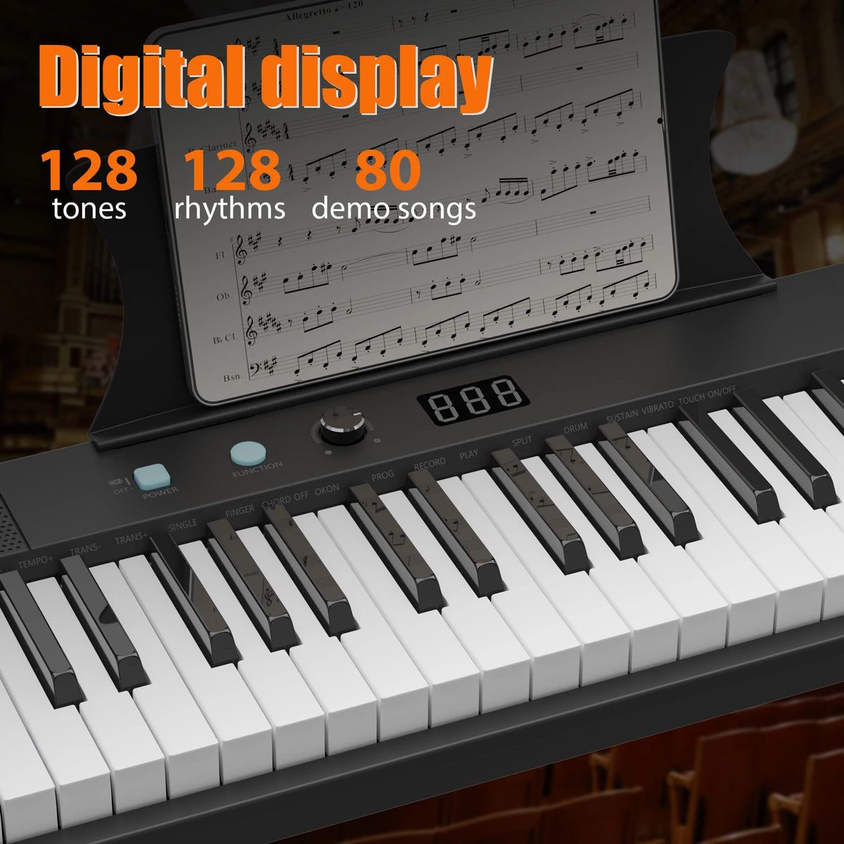 A digital display piano showing musical notation and keys, with a keyboard visible below.