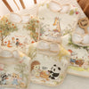 A collection of soft cotton waterproof baby bibs featuring cute animal illustrations and adjustable neck straps.