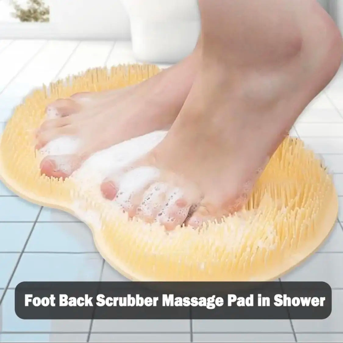A person's feet are being scrubbed with a yellow silicone massage pad in a shower.
