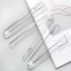 Transparent foldable plastic rulers for students displayed on a white background.