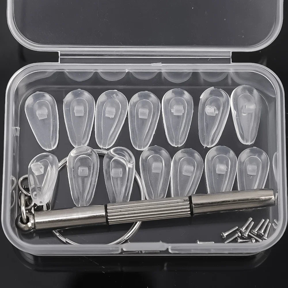 A clear plastic case containing soft silicone air chamber nose pads and a mini screwdriver for glasses repair.