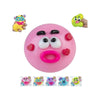 A pink squishy toy with face-changing features, including a yellow and purple character head.