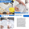 A set of gray double-layer microfiber cleaning cloths being used to wipe and clean kitchen surfaces.