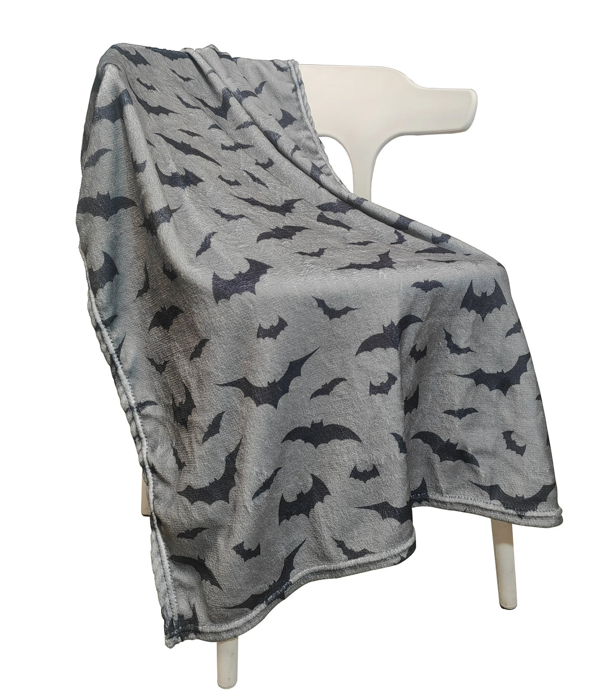A gray flannel throw blanket printed with black bats draped over a white hanger.