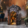 A wooden book nook kit featuring a dragon treasure labyrinth design, displayed as a decorative miniature.