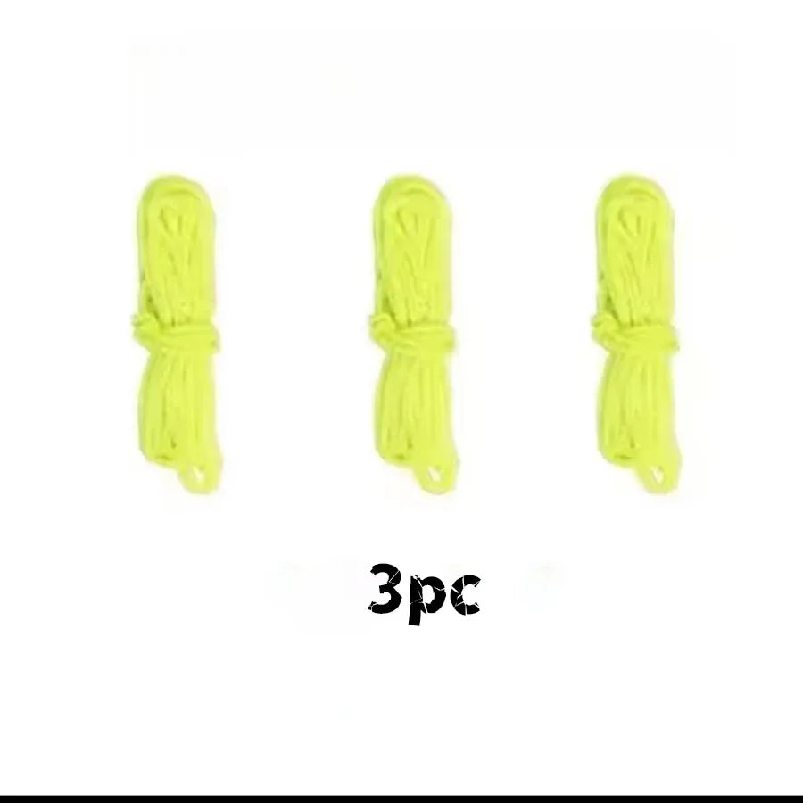 Three glow-in-the-dark yellow string launcher toys for kids