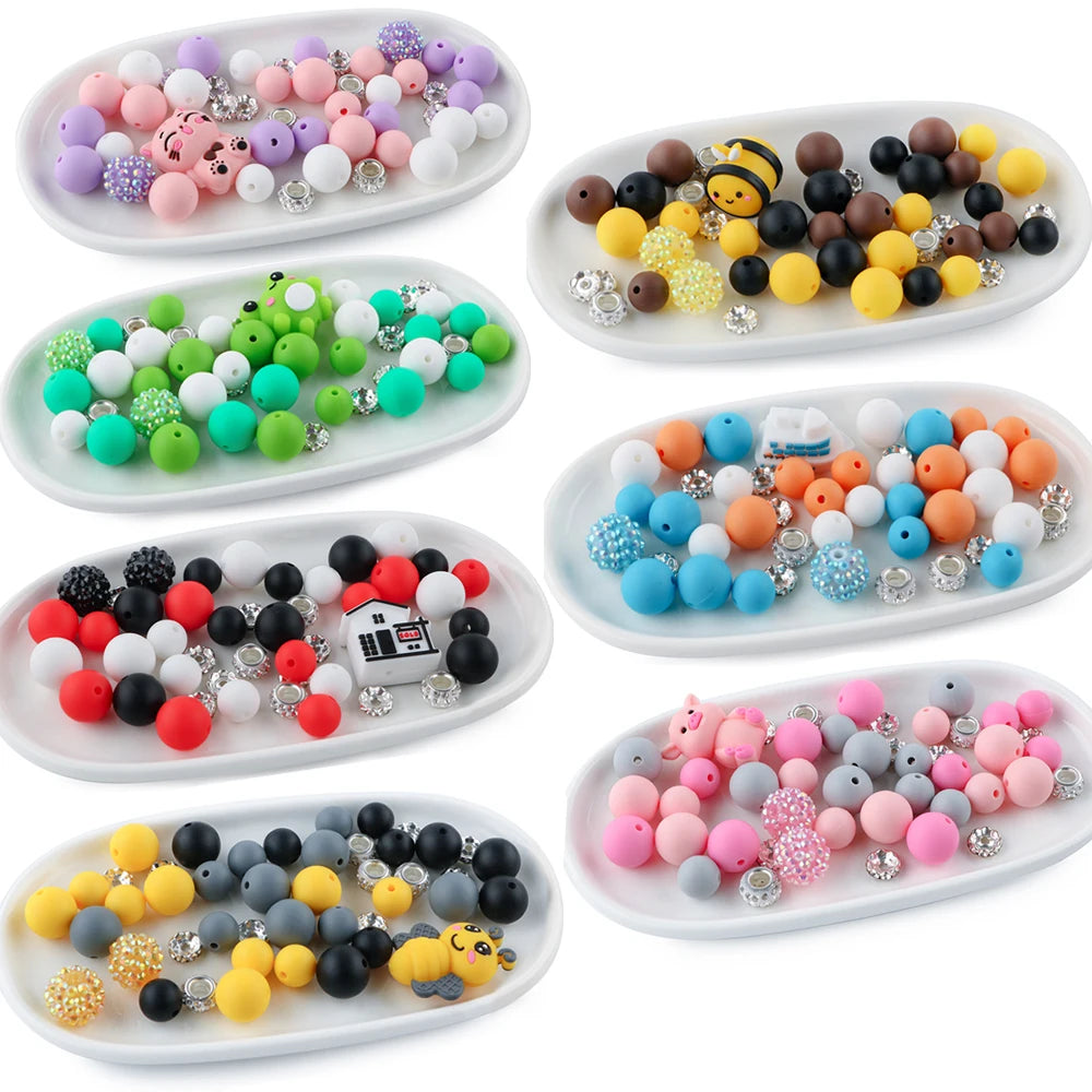 A collection of 45 round silicone beads in various colors and animal shapes for jewelry making.