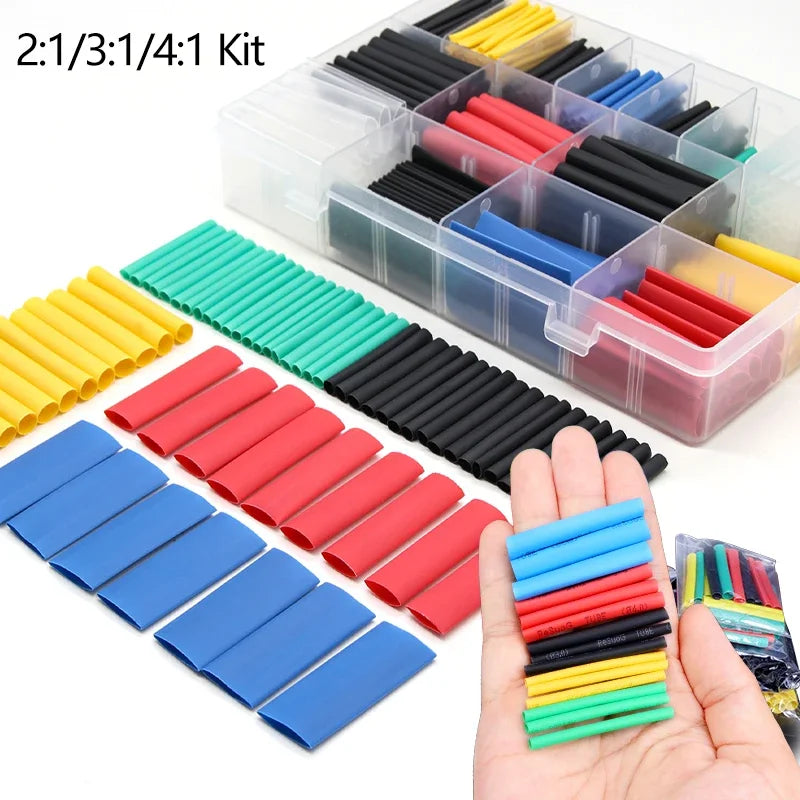 A kit of heat shrink tubing in various colors and ratios, including yellow, red, blue, black, and green.