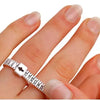 A hand is wearing an adjustable ring and bracelet sizer measuring tool on its finger.