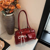 Bolso de hombro suave con detalle de lazo
