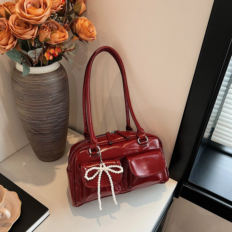 Bolso de hombro suave con detalle de lazo