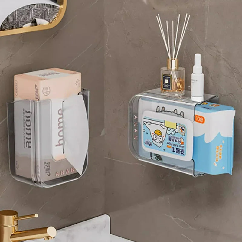 Ein klaren wandmontierten Dispenser hält Toilettenpapier und eine kleine Flasche auf einer grauen Marmoroberfläche.