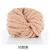 A ball of light beige chunky acrylic yarn used for knitting and crochet projects.
