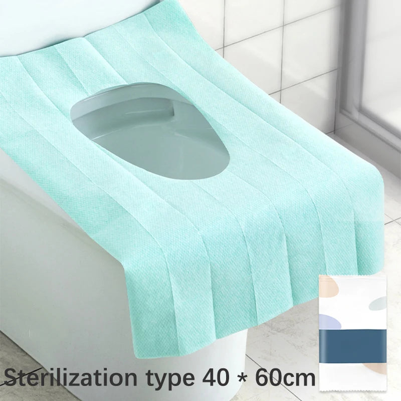 Light blue disposable toilet seat cover with pleated design shown on a white toilet.