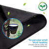Black stitched-edge non-slip mouse pad showing a cup of liquid being poured onto a tree trunk.