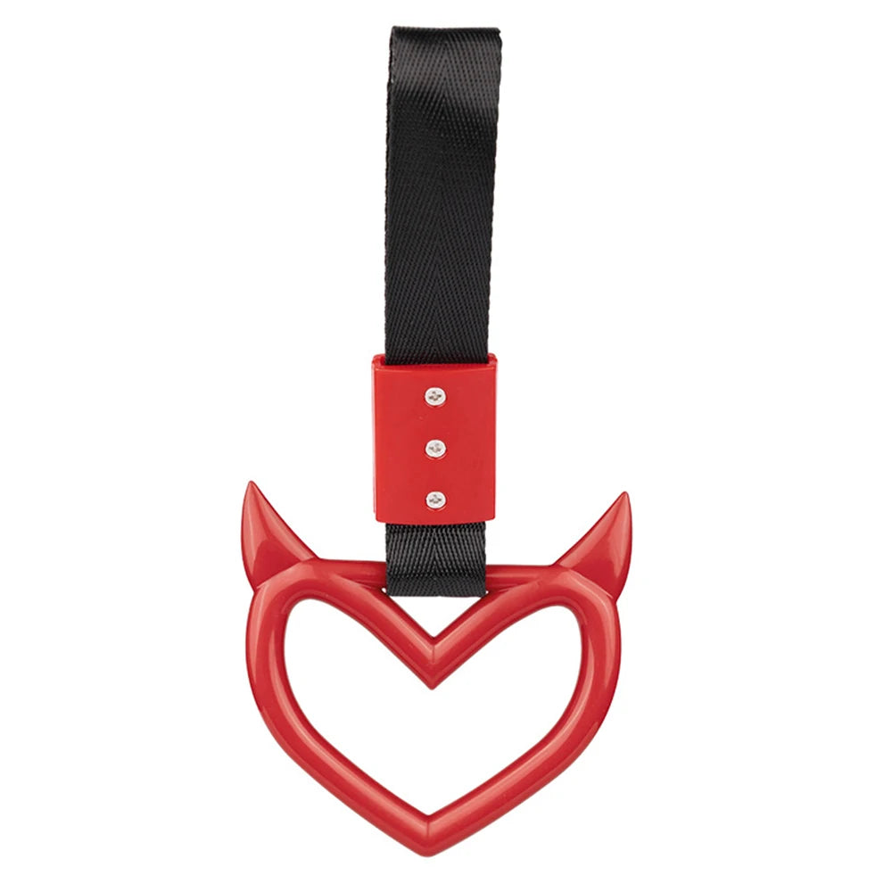 A red heart-shaped ring drift handle with a black strap.