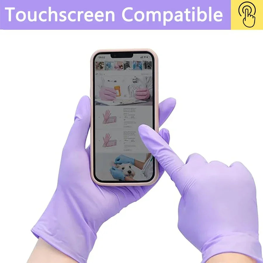 A hand wearing purple nitrile gloves is touching a smartphone screen, demonstrating touchscreen compatibility.