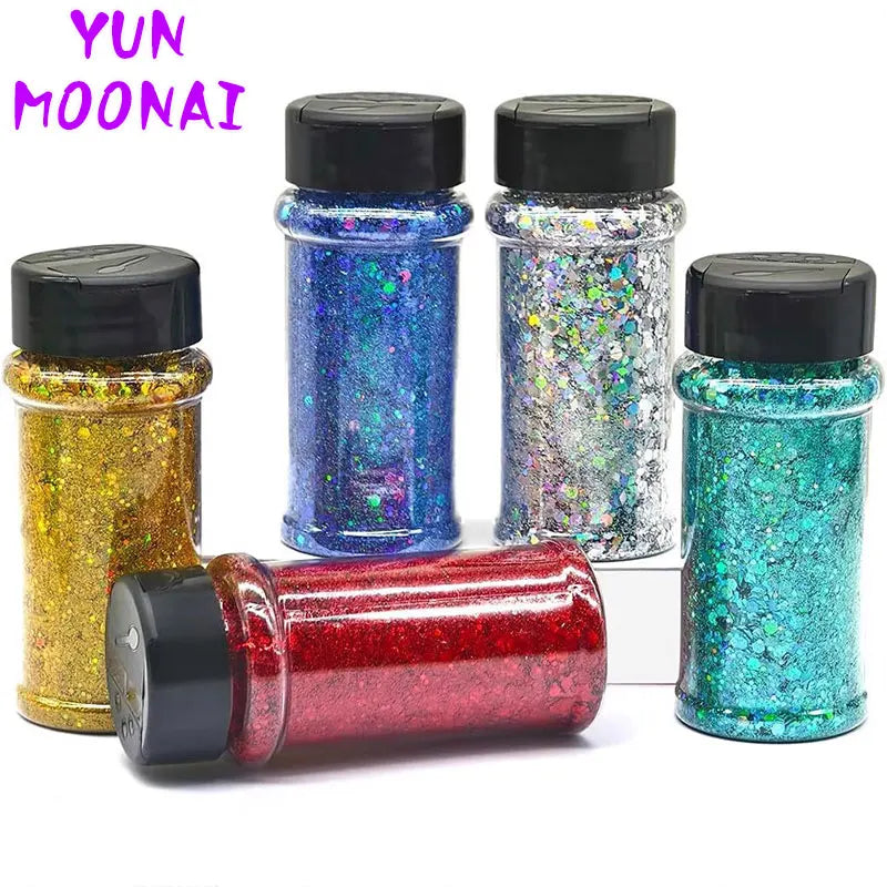 A collection of four glass jars filled with various holographic glitter nail polish colors and a red glitter product.