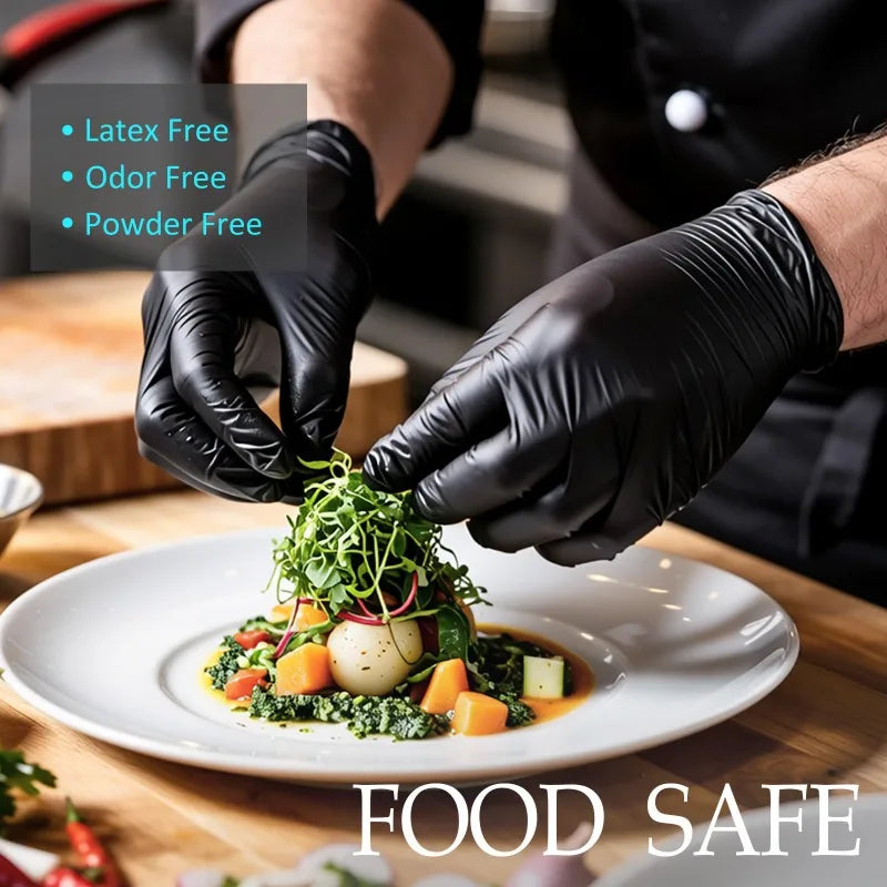 Hands wearing black disposable gloves are carefully plating a green salad on a white plate.