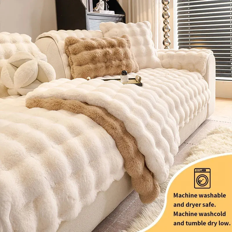 A cream plush sofa cushion cover with a brown faux fur accent, showing machine washable and dryer safe features.