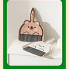 A set of compact cartoon broom and dustpan for tabletop cleaning, featuring a bear-themed design.