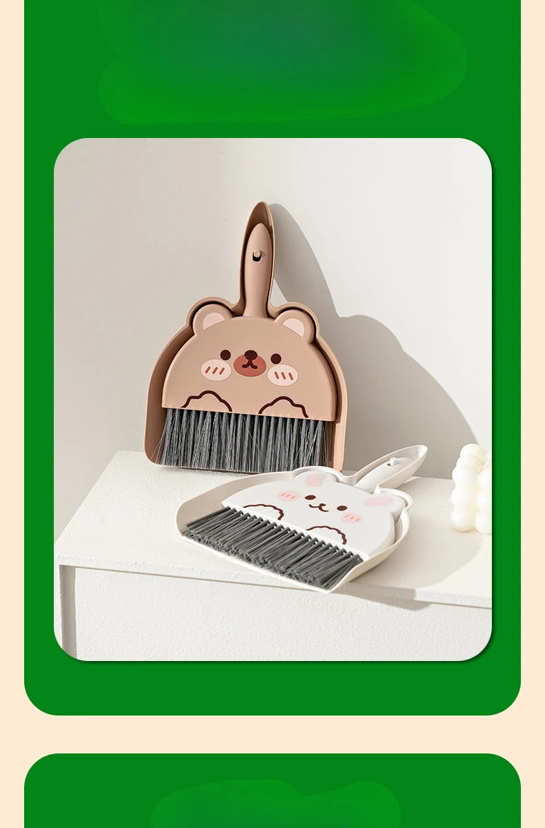 A set of compact cartoon broom and dustpan for tabletop cleaning, featuring a bear-themed design.