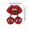 A pair of sparkling red rhinestone patches shaped like lips and eyes for clothing and DIY crafts.