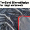 Two sided design for rough and smooth surfaces shown on a dark fabric towel