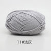 A ball of light gray 11-ply yarn for knitting and crochet.